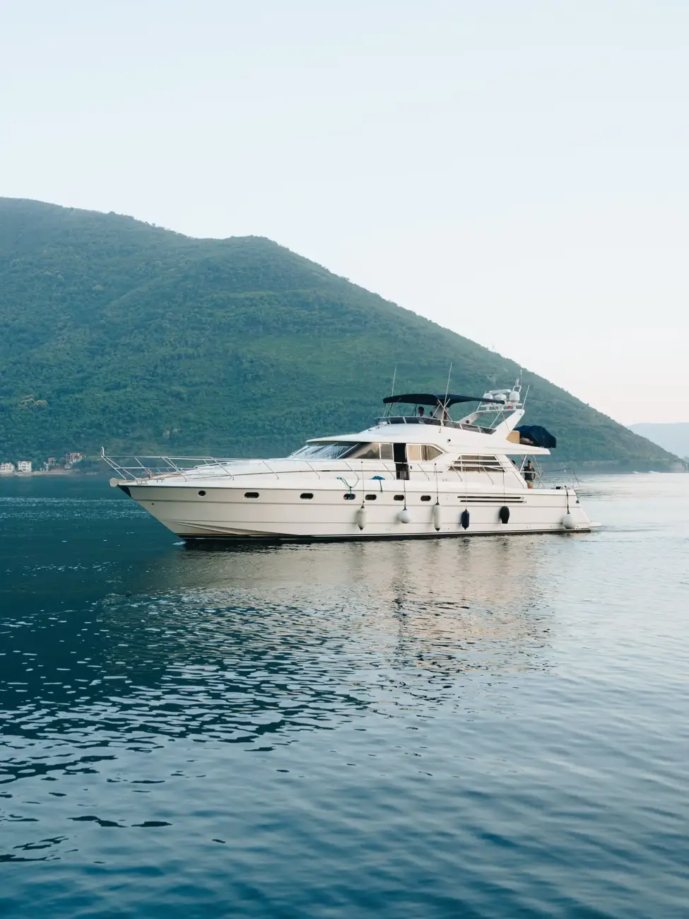white-cruise-yacht-water-near-mountains-montenegro